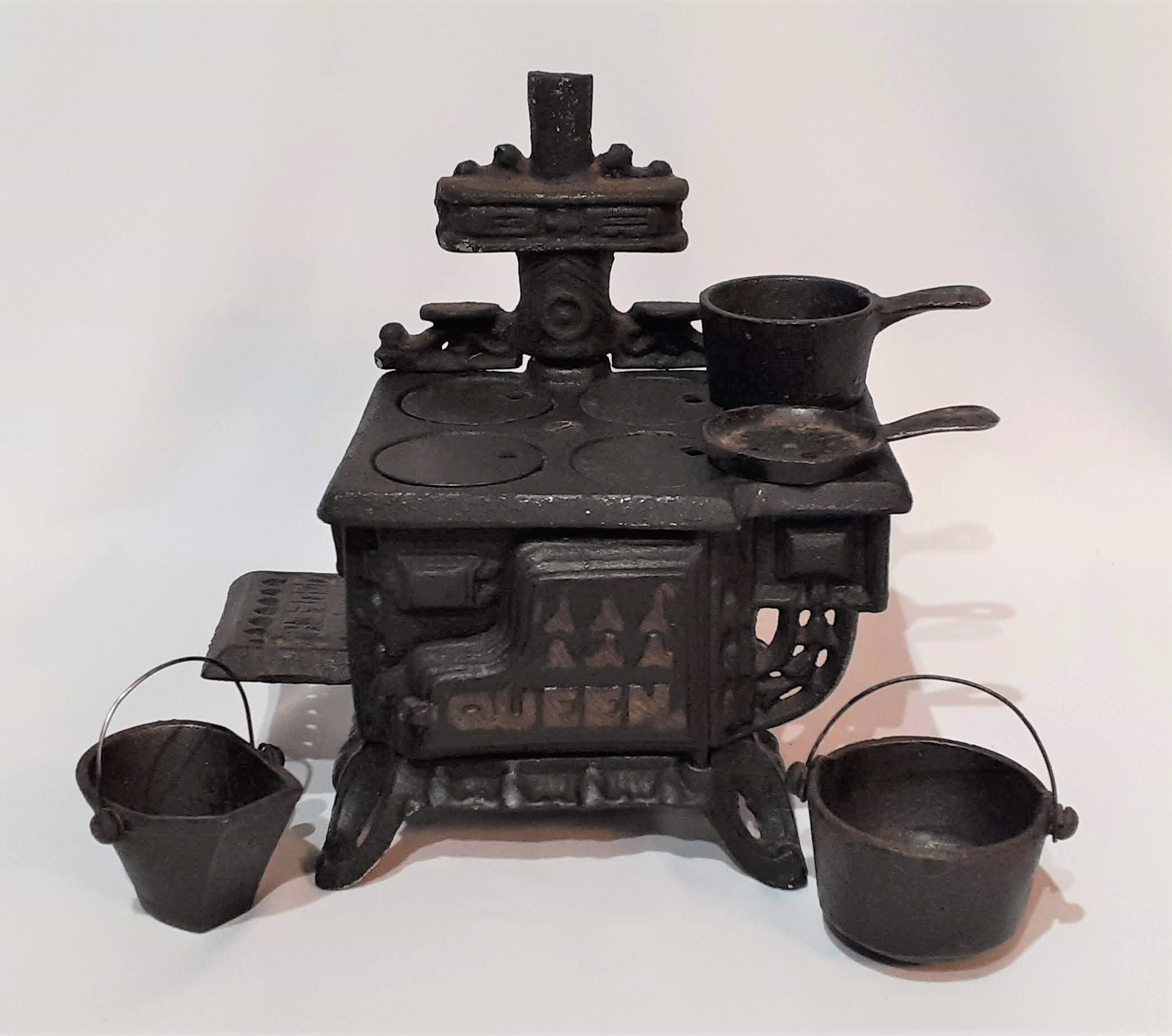 Old toy stoves: kids used to cook with cast-iron heated by coals