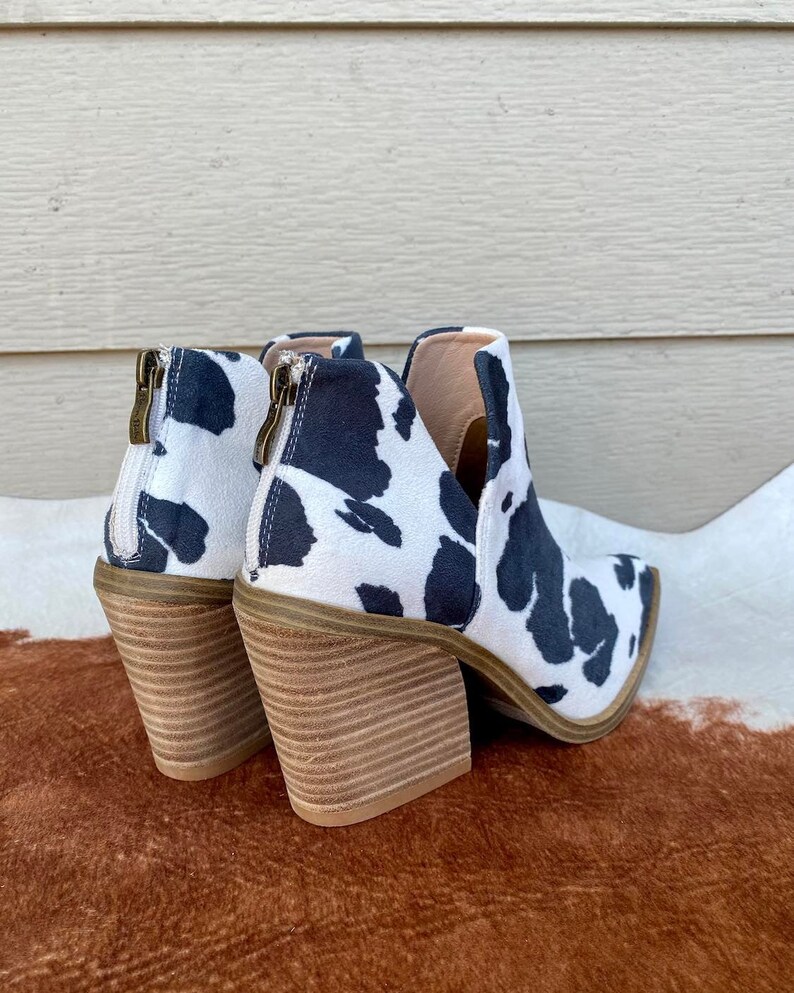 dolce vita cow print booties