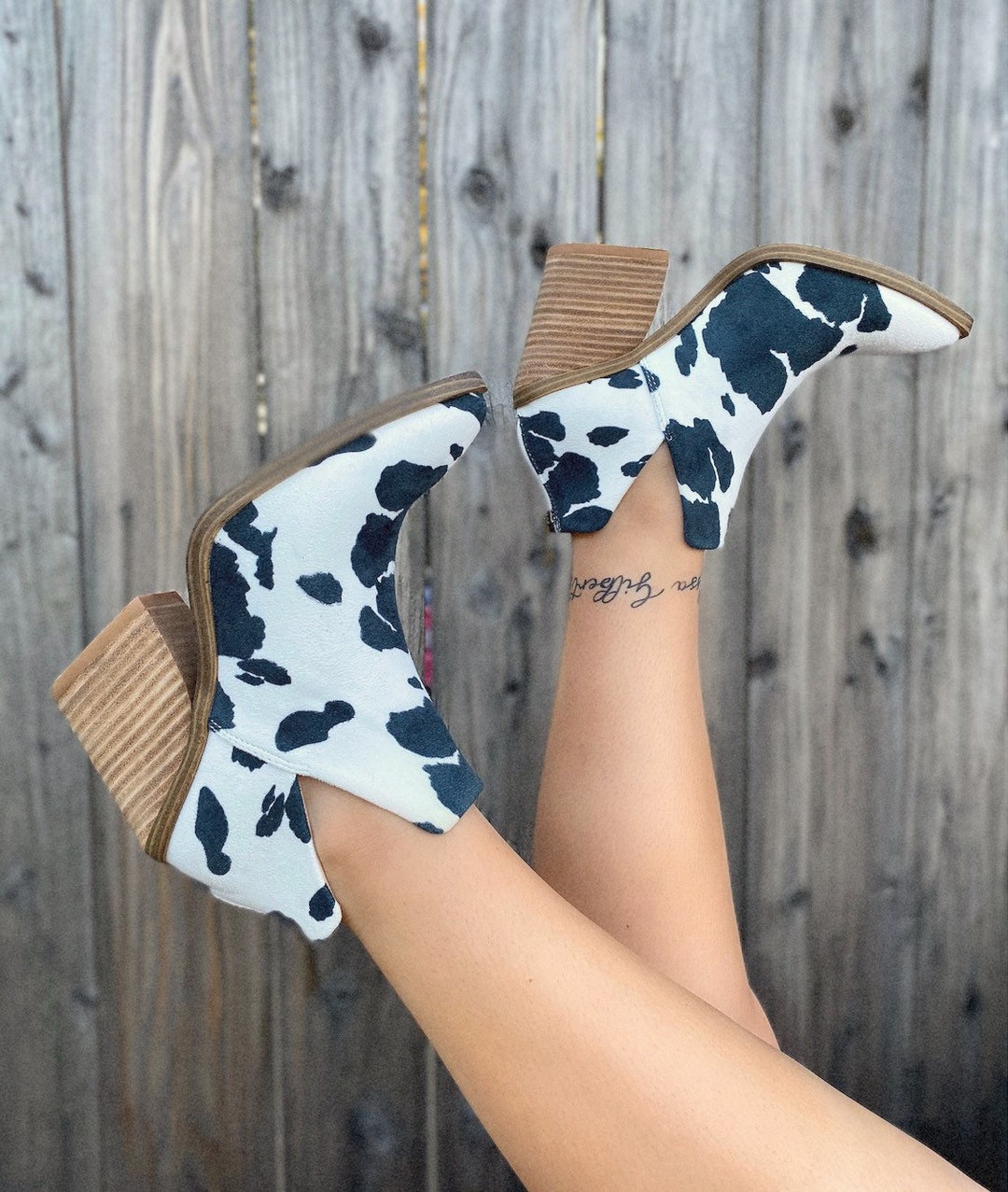 dolce vita cow print booties