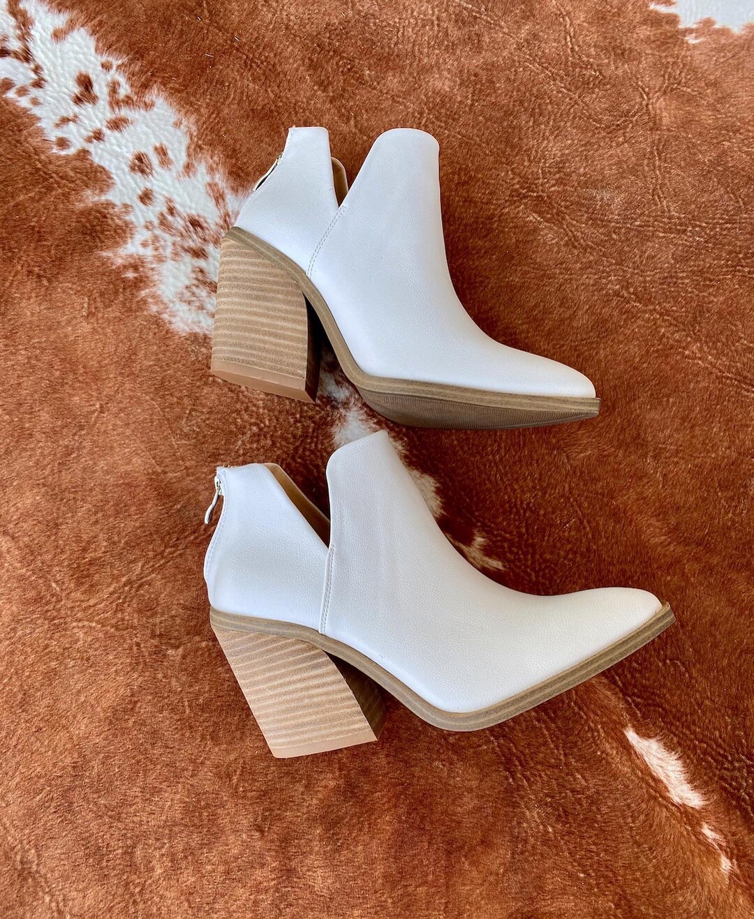 dolce vita cow print booties