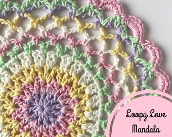 Può includere: Uno schema di mandala all'uncinetto colorato in tonalità di rosa, giallo, verde e viola. Lo schema si chiama "Loopy Love Mandala PDF Pattern".