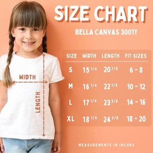 May include: Size chart for Bella Canvas 3001Y t-shirts, showing width and length measurements in inches for sizes S, M, L, and XL. The chart also includes corresponding fit sizes for each size.