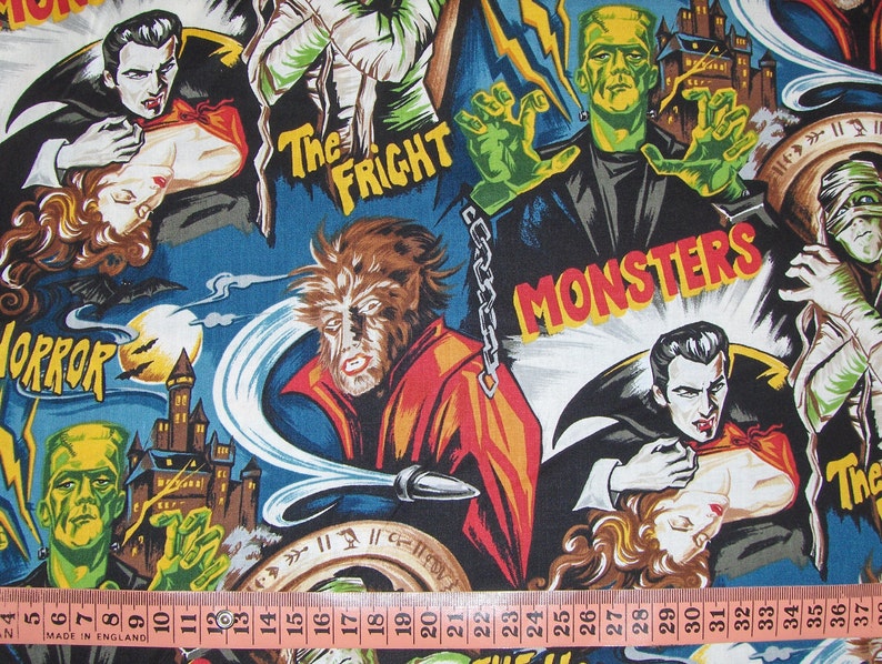 May include: A colourful fabric with a repeating pattern of classic horror movie monsters. The fabric features images of Frankenstein, Dracula, the Wolfman, and the Mummy. The fabric also includes the words "Horror", "The Fright", and "Monsters".