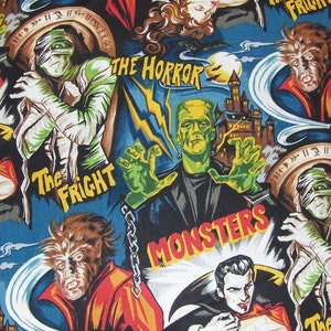May include: A colourful fabric with a repeating pattern of classic horror movie monsters. The fabric features a green Frankenstein, a werewolf, a mummy, and a vampire. The fabric has the text "The Horror", "The Fright", and "Monsters" printed on it.