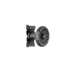 May include: A black metal door knob with a decorative, circular design. The knob has a square backplate with a floral design.