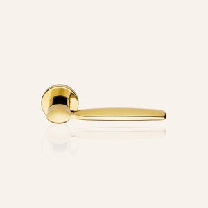 May include: A gold door handle with a rounded knob and a long, straight lever.