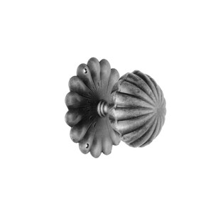 May include: A black metal door knob with a decorative, scalloped design. The knob has a round, fluted shape and a flat, decorative backplate.