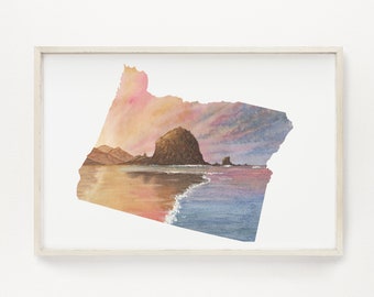 Puede incluir: Una pintura de acuarela del estado de Oregón, con una escena de puesta de sol sobre el océano y Haystack Rock en el fondo.