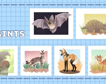 May include: A set of six prints featuring various animals, including a bat, armadillo, serval, African wild dog, and a small antelope. The prints are all in a similar style, with a white background and a light blue border. The title "PRINTS" is displayed at the top of the image.