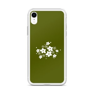 Pu&ograve; includere: Una custodia per telefono trasparente con sfondo verde e un design floreale bianco.