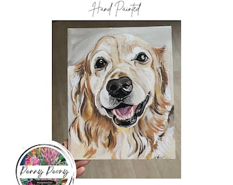 May include: Hand-painted custom pet portrait of a Golden Retriever. The artwork features a close-up of the dog's face with a happy expression, showcasing its fur in shades of gold and cream. The canvas has the text "Custom Pet Portrait Hand Painted".