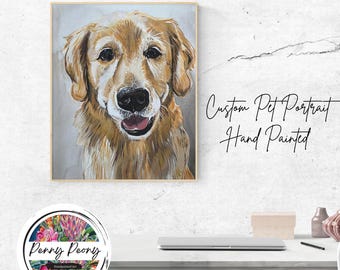 May include: Hand-painted custom pet portrait of a Golden Retriever dog. The artwork features the dog's face with a happy expression, in shades of gold, brown, and white. The artwork is framed and displayed on a white wall. Text on the wall reads "Custom Pet Portrait Hand Painted".