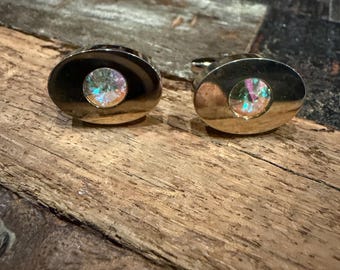 Pair of vintage Sarah Cov (Coventry) gold tone and aurora borealis prism stone   "Neptune" cufflinks from the late 1960s—circa 1969