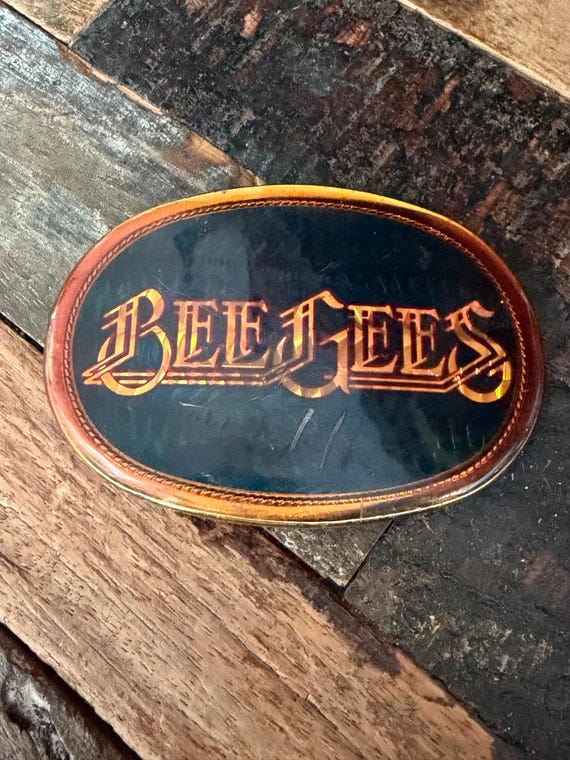 Bee Gees 1978 Pacifica Mfg vintage oval shaped holographic belt buckle, pop music memorabilia