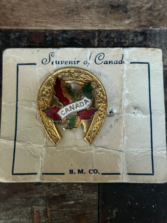 1952 B.M. Co. Canadian souvenir brooch with an ena