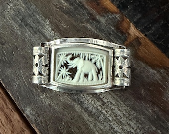 Art Deco vintage silver tone and carved celluloid elephant in jungle pin/brooch with trombone clasp