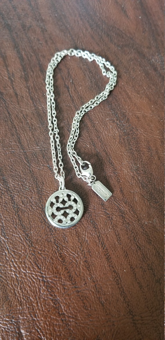silver coach necklace