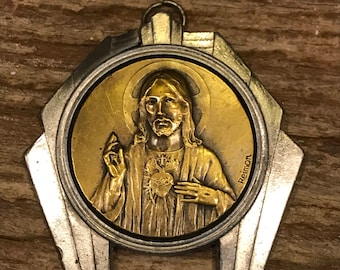 Vintage signed Reimon medallion of Jesus with Sacred Heart in a silver tone Art Deco frame