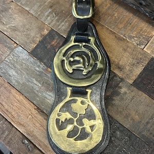 Vintage horse harness brass medallions on leather base,  horseshoe with horse head and flowers horse brasses