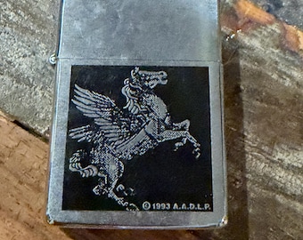Vintage 1994 Zippo Pegasus Collectable Lighter featuring a winged horse design, silver tone with a rearing winged Pegasus in black