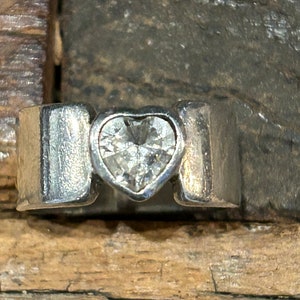 925 sterling wide band with heart shaped clear crystal stone size 6 1/2