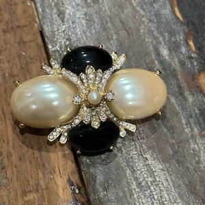 Vintage Joan Rivers gold tone, rhinestone, black stone and faux pearl brooch