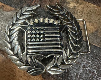 Famous Stars & Straps Cadillac American Flag belt buckle with polished chrome finish and iconic laurel wreath design
