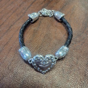Retired Brighton Cupid's Bandit Leather and Heart Bracelet, 7.75 to 8.5 Inch Black Woven Leather Bracelet w/Silver-Plated Heart & Bead Caps