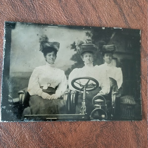 She Drives Me Crazy: Antique Tintype Photograph of 3 Women Posing in an Automobile and Wearing Fabulous Hats