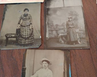 May include: Collection of five vintage tintype photographs featuring women in various poses and clothing. The photos are in black and white and have a faded, antique look.