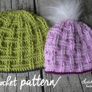 May include: Two crocheted hats, one green and one pink, with a white pom pom on the pink hat. The hats have a woven pattern and a crocheted border. The text "crochet pattern" is written below the hats.