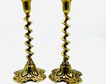 A Fine & Unusual 25cm Tall Pair of Solid Brass Barely Twist Indian Candle Holders with Ancient Symbols on the Base