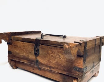 An Unusual Wooden Lidded Box with Side Shafts & Wooden Wheels Fastened with an Iron Clasp and Metal Bandings / Antique Apprentice Piece