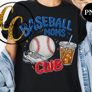 May include: Black t-shirt with a baseball-themed graphic. The design includes the words "Baseball Moms Club" in blue and red, a baseball, a pair of sneakers, and a drink with ice.