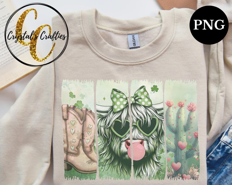 May include: A beige sweatshirt with a graphic print of a Highland cow wearing heart-shaped sunglasses, a bow, and a bubble, along with a pair of cowboy boots and a cactus with hearts.