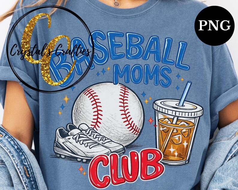 May include: Blue t-shirt with a baseball theme. The shirt features the words "Baseball Moms Club" in blue and red, a baseball, a pair of cleats, and a drink with a straw. The shirt has a vintage, distressed look.