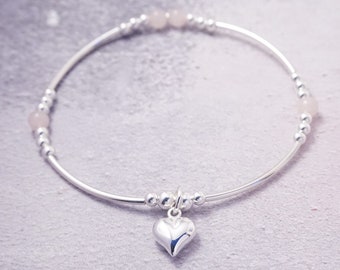 Sterling Silver stretch noodle bracelet with Rose Quartz beads and Medium Heart charm