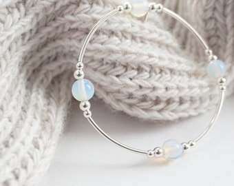 Sterling Silver noodle bracelet with Opalite beads.