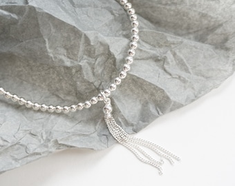 Sterling Silver stretch anklet with Tassel Charm