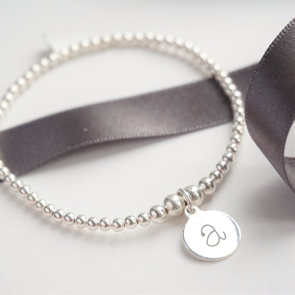 Sterling Silver stretch bracelet with 1 Lowercase Initial charm pendant
