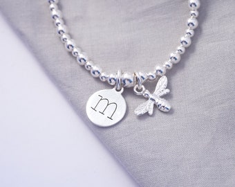 Sterling Silver stretch bracelet with lowercase initial charm and bumble bee charm