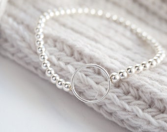 Sterling Silver stretch bracelet with Karma Circle connector