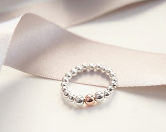 Sterling Silver stretch ring with Rose Gold Filled bead.