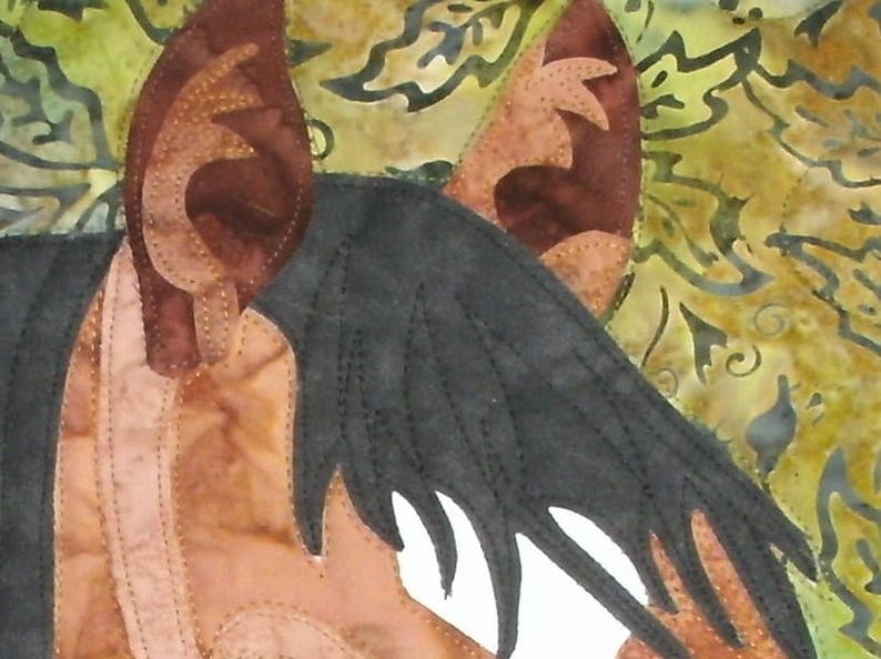 May include: A close-up of a brown and black horse's head with a black mane and a white muzzle. The horse's ears are pointed and the background is a blurry floral pattern.