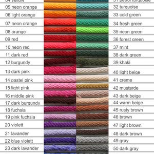 May include: A color chart of 54 different colors of cord, with each color labeled with a number and a name. The colors range from white to black, and include shades of red, orange, yellow, green, blue, pink, purple, brown, and gray.