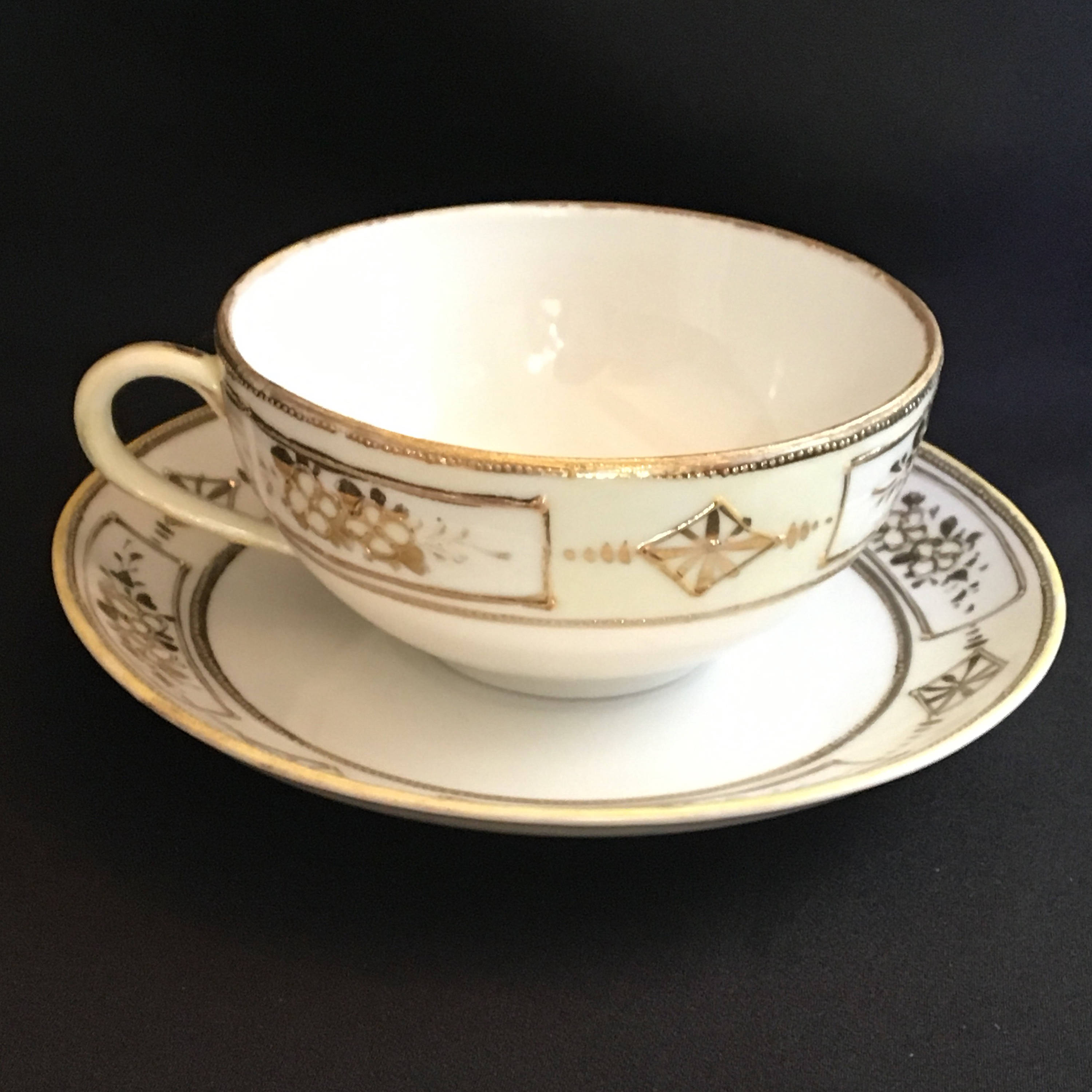 Vintage 1940 era handpainted Japanese porcelain raised gilded cup and saucer Vintage 1940 era handpainted Japanese porcelain raised gilded cup and saucer