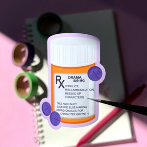 The image shows a sticker shaped like an orange and white medical pill bottle. The bottle is for the drama genre in books, movies, television, and other forms of media. The design is accented with purple and pills with drama masks on it. The text reads - Drama 89mg, confict, miscommunication, messed up characters. Take and enjoy someone else making stupid choices for character growth.