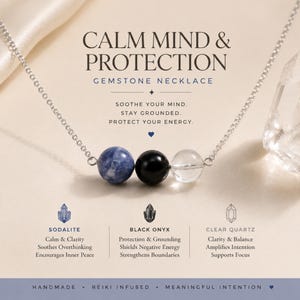 May include: A silver chain necklace featuring three round beads: a blue and white sodalite bead, a black onyx bead, and a clear quartz bead. The text reads: CALM MIND & PROTECTION GEMSTONE NECKLACE, SOOTHE YOUR MIND. STAY GROUNDED. PROTECT YOUR ENERGY.