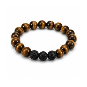 May include: A beaded bracelet featuring smooth, polished, golden-brown tiger's eye beads arranged in a circular band, accented by three textured, porous, matte black lava stone beads positioned together at the front of the piece.