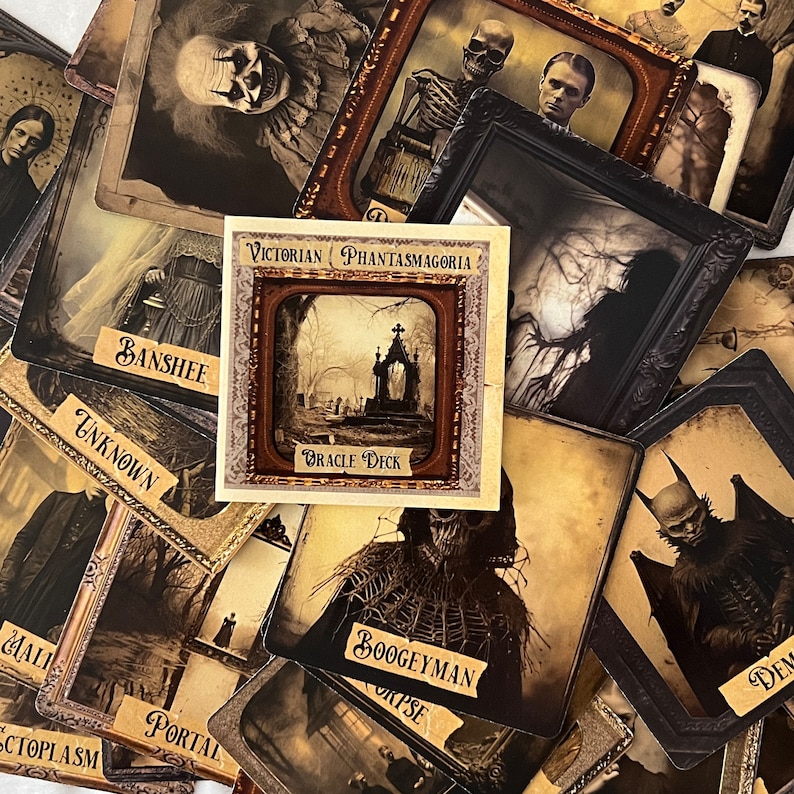 May include: A set of vintage-style oracle cards with illustrations of various characters and scenes. The cards feature a dark, gothic aesthetic and include titles such as "Banshee", "Boogeyman", "Unknown", and "Portal". The cards are part of a "Victorian Phantasmagoria Oracle Deck".
